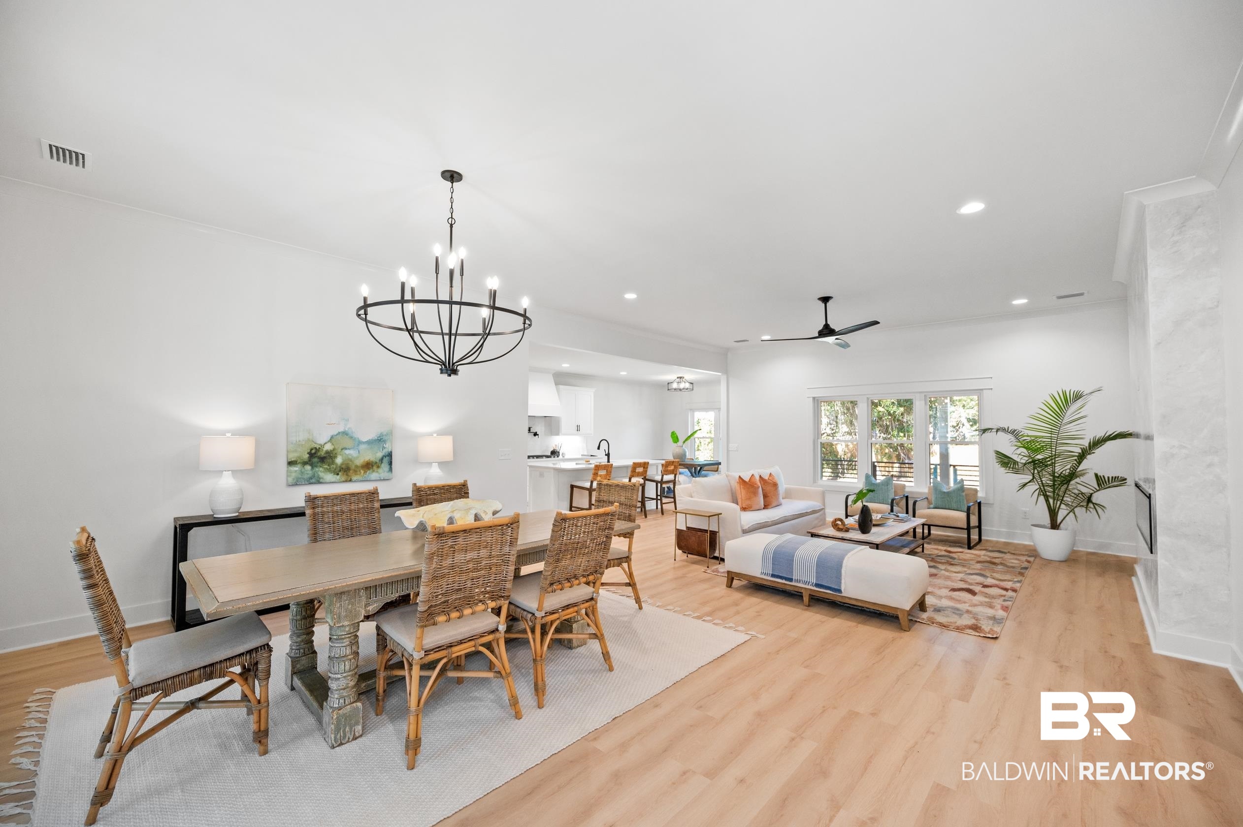28889 Canal Road Orange Beach, AL 36561 - Photo 5 of 55 Dining area with ceiling fan with notable chandelier, light hardwood / wood-style floors, and crown molding