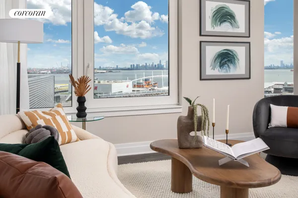 a living room with furniture and a floor to ceiling window