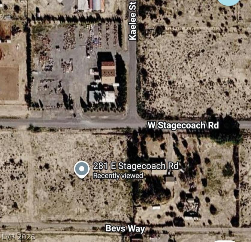 281 West Stagecoach Road Pahrump, NV 89060 - Photo 4 of 5 An overhead perspective reveals a broad parcel of land with established structures and mature landscaping, offering varied development opportunities.