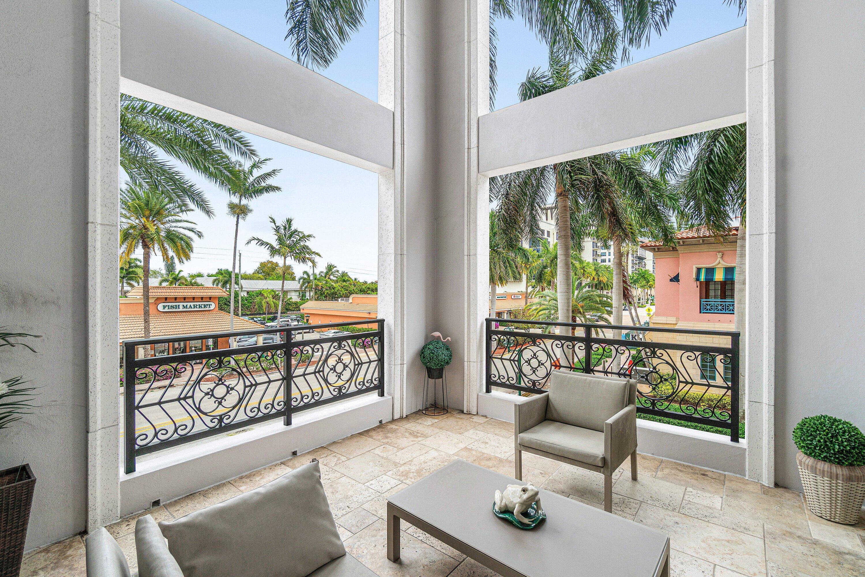 200 East Palmetto Park Road, Unit 22 Boca Raton, FL 33432 - Photo 15 of 44 a living room with large windows and a table