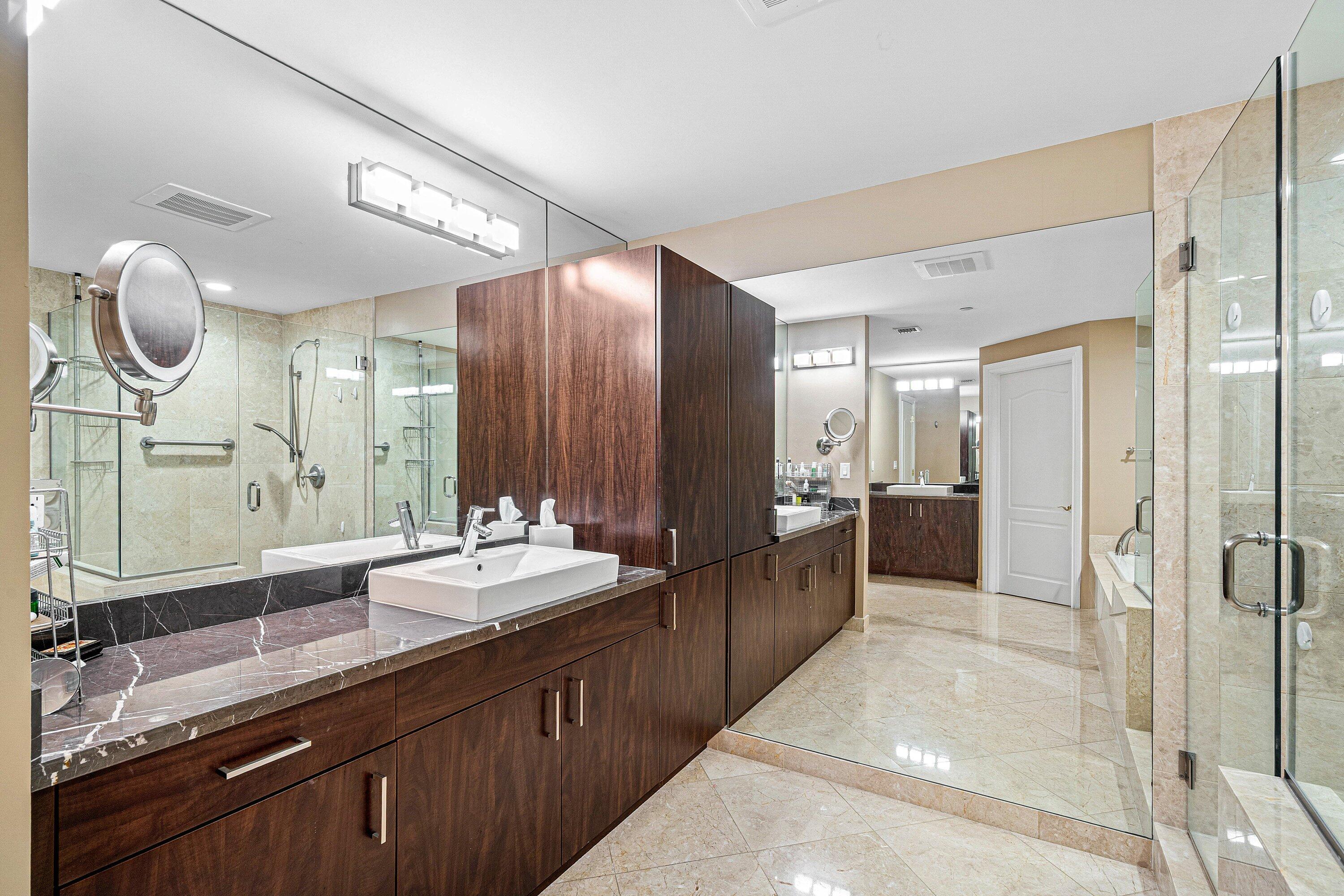 200 East Palmetto Park Road, Unit 22 Boca Raton, FL 33432 - Photo 25 of 44 a bathroom with a double vanity sink mirror double and shower