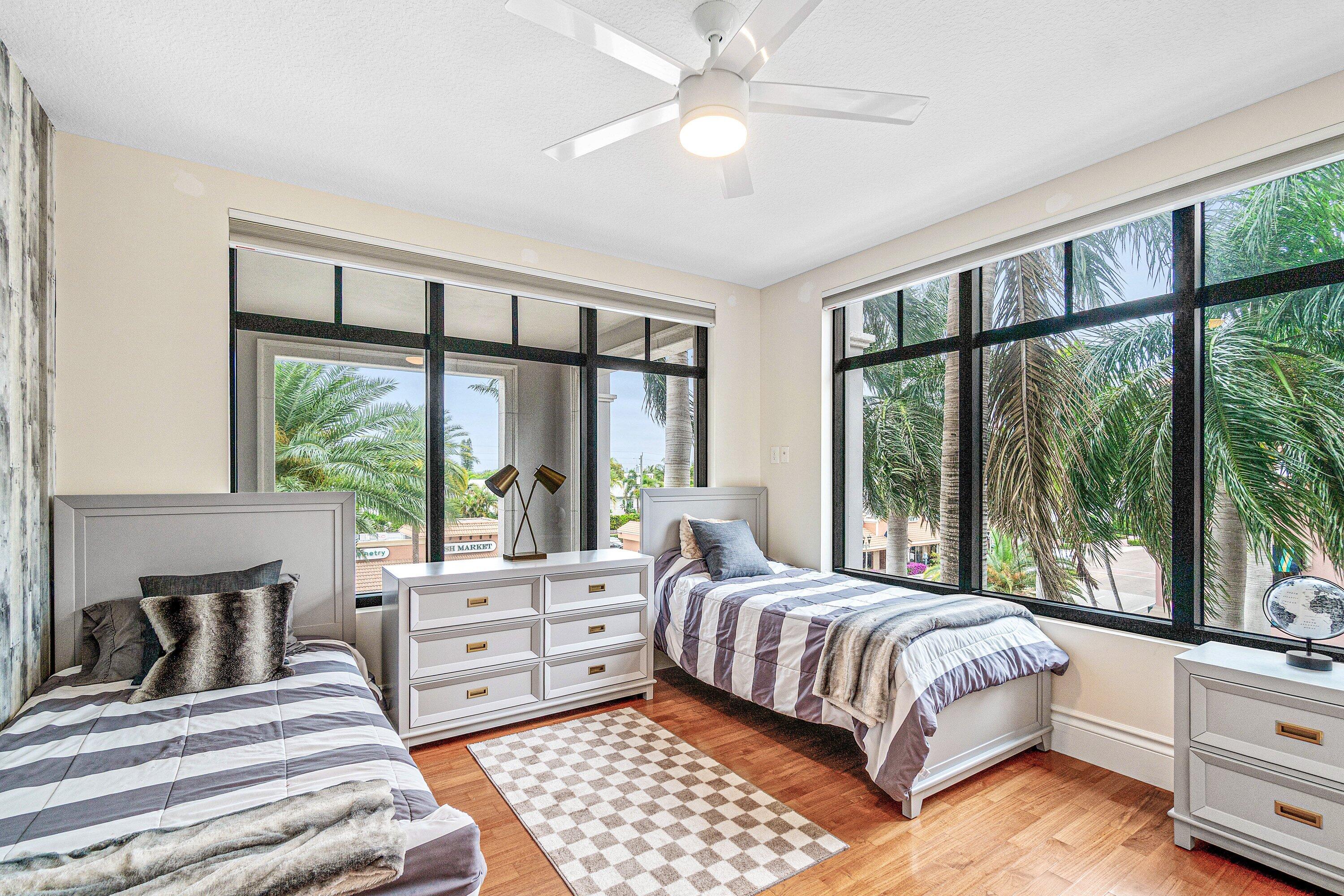 200 East Palmetto Park Road, Unit 22 Boca Raton, FL 33432 - Photo 28 of 44 a bedroom with a large bed and a large window