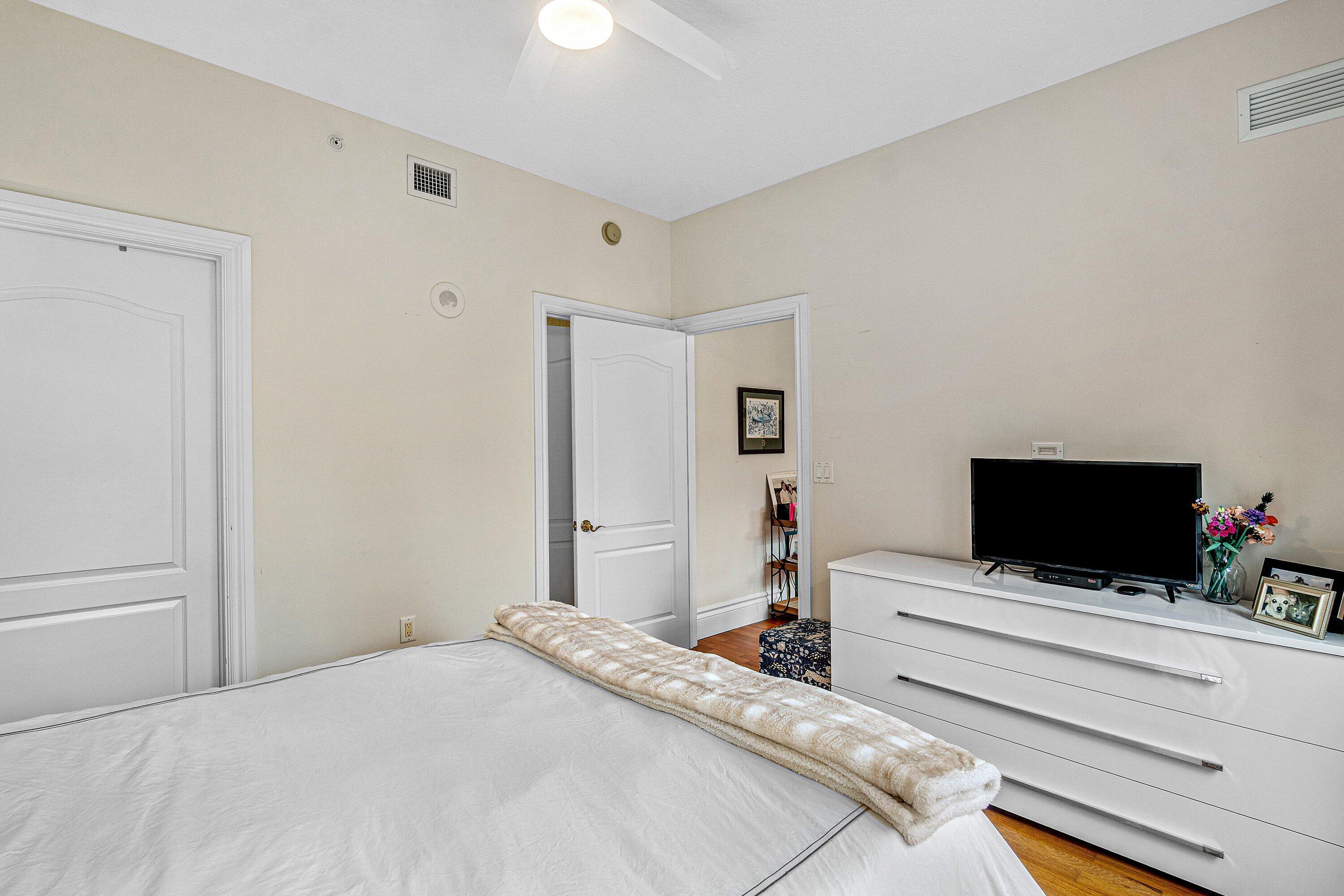 200 East Palmetto Park Road, Unit 22 Boca Raton, FL 33432 - Photo 30 of 44 a bedroom with bed and tv