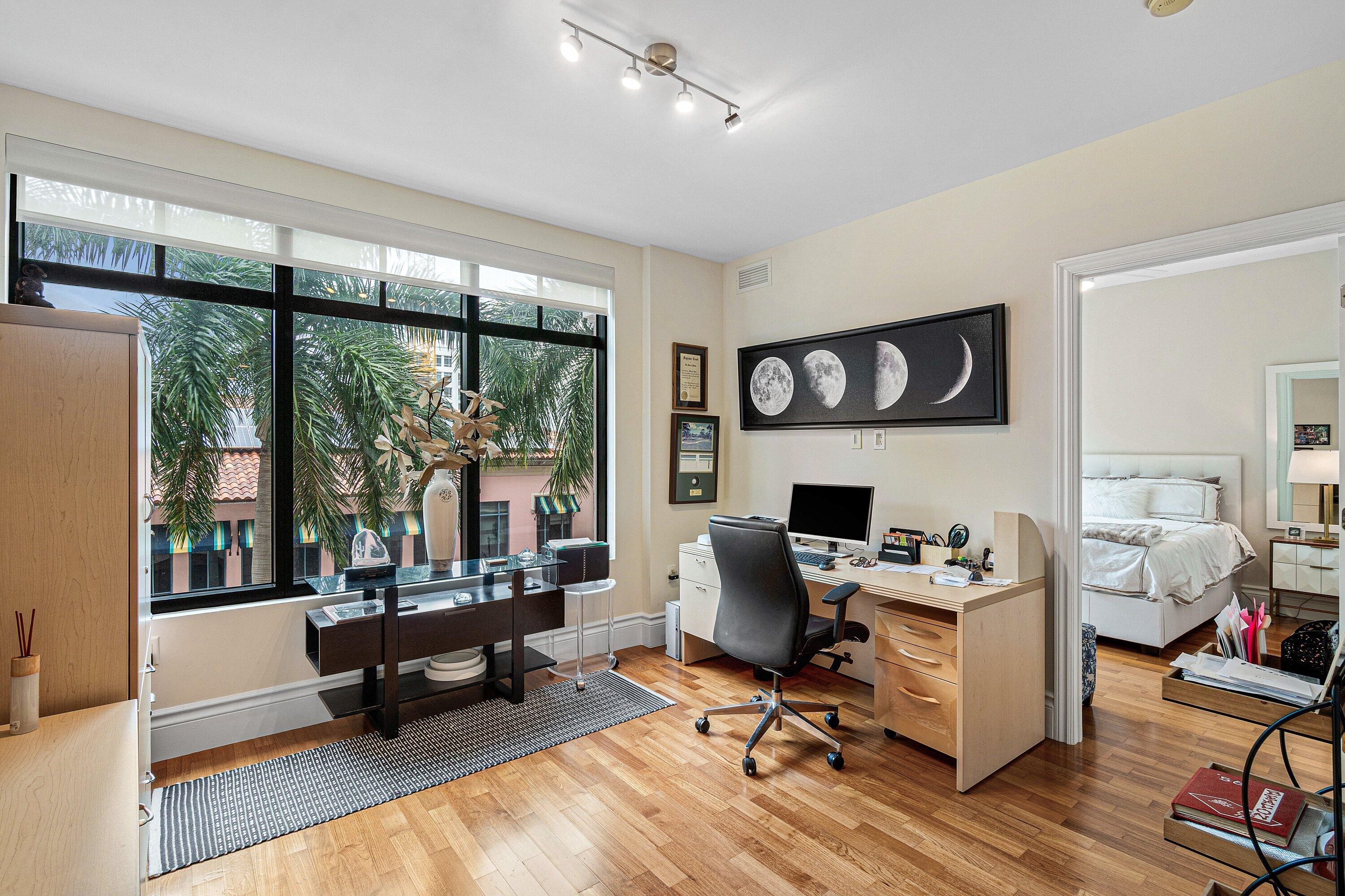 200 East Palmetto Park Road, Unit 22 Boca Raton, FL 33432 - Photo 31 of 44 a work room with furniture a rug potted plant and a large window