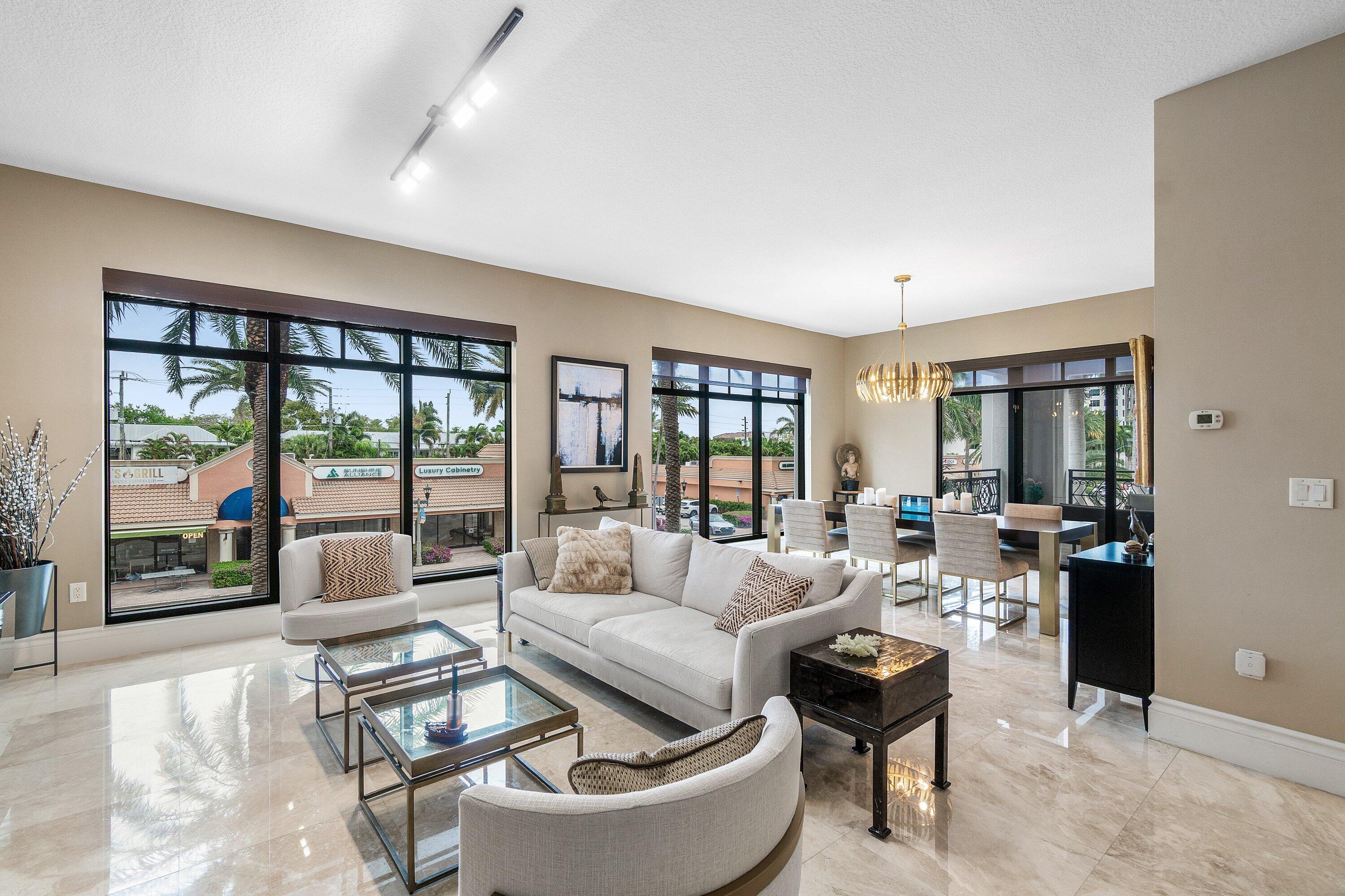 200 East Palmetto Park Road, Unit 22 Boca Raton, FL 33432 - Photo 4 of 44 a living room with furniture and a floor to ceiling window