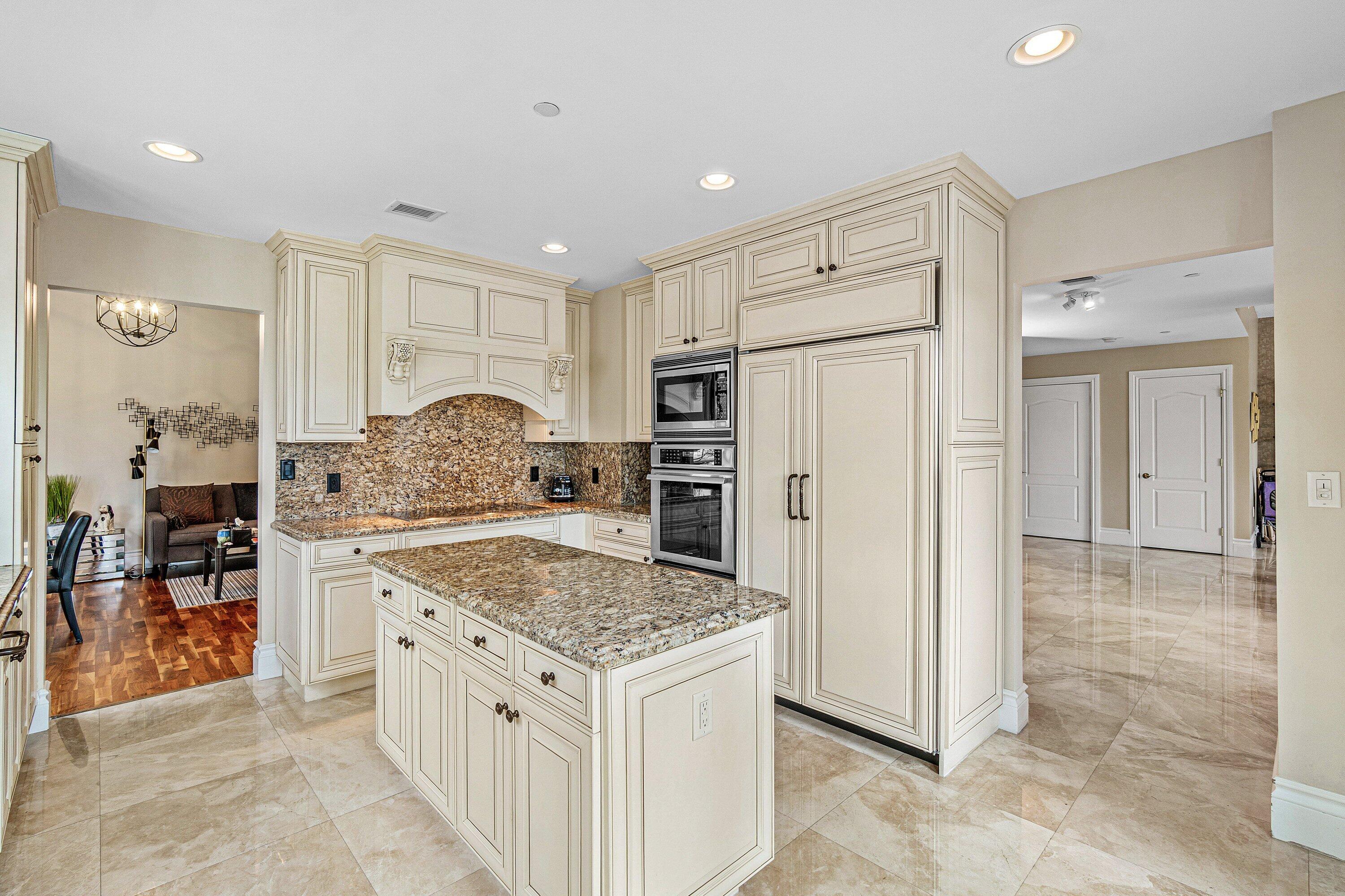 200 East Palmetto Park Road, Unit 22 Boca Raton, FL 33432 - Photo 10 of 44 a kitchen with stainless steel appliances granite countertop a refrigerator and a stove