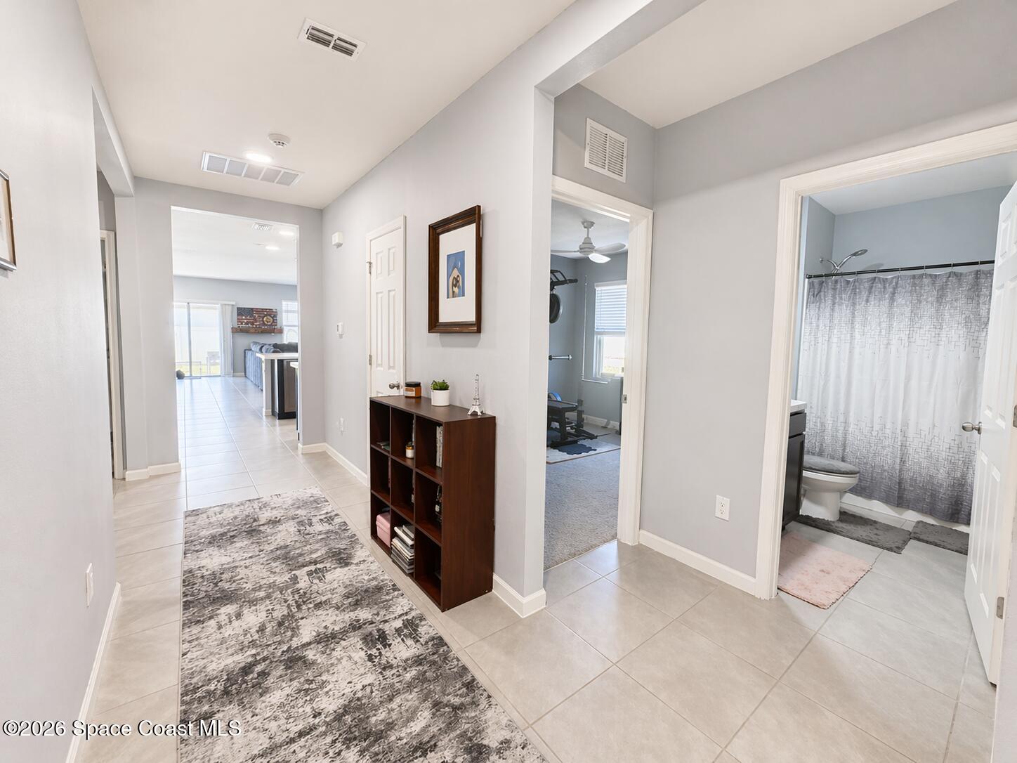 4731 Talbot Boulevard Cocoa, FL 32926 - Photo 2 of 18 a view of a room with cabinet and mirrors