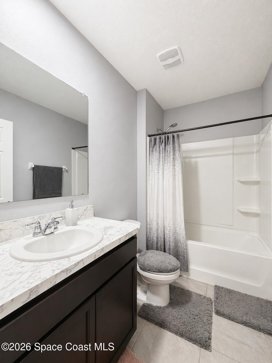4731 Talbot Boulevard Cocoa, FL 32926 - Photo 6 of 18 a bathroom with a sink a toilet a tub and shower
