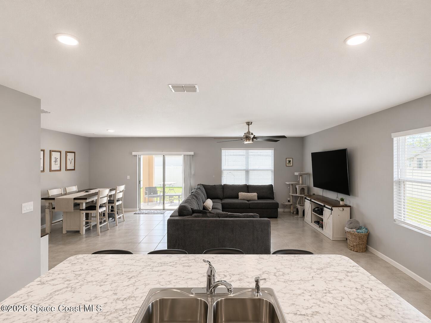 4731 Talbot Boulevard Cocoa, FL 32926 - Photo 8 of 18 a living room with furniture and a flat screen tv