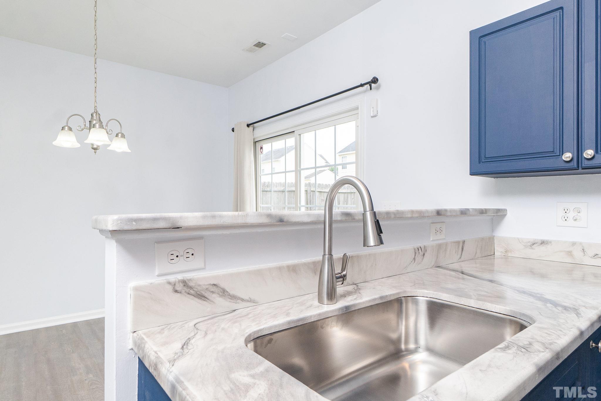 6920 Missionary Ridge Drive Raleigh, NC 27610 - Photo 17 of 34 a close view of sink and tap
