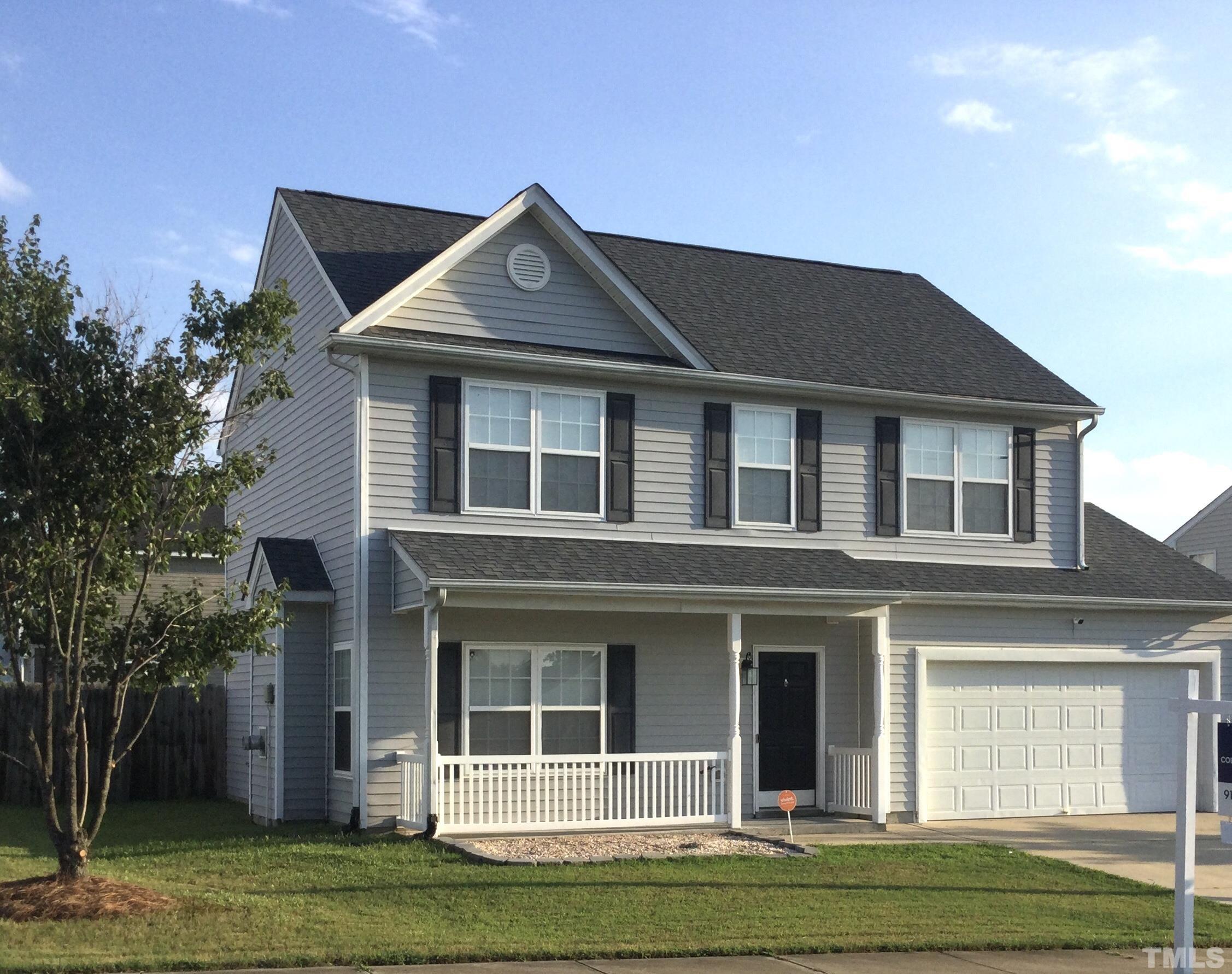 6920 Missionary Ridge Drive Raleigh, NC 27610 - Photo 2 of 34 a front view of a house with a yard