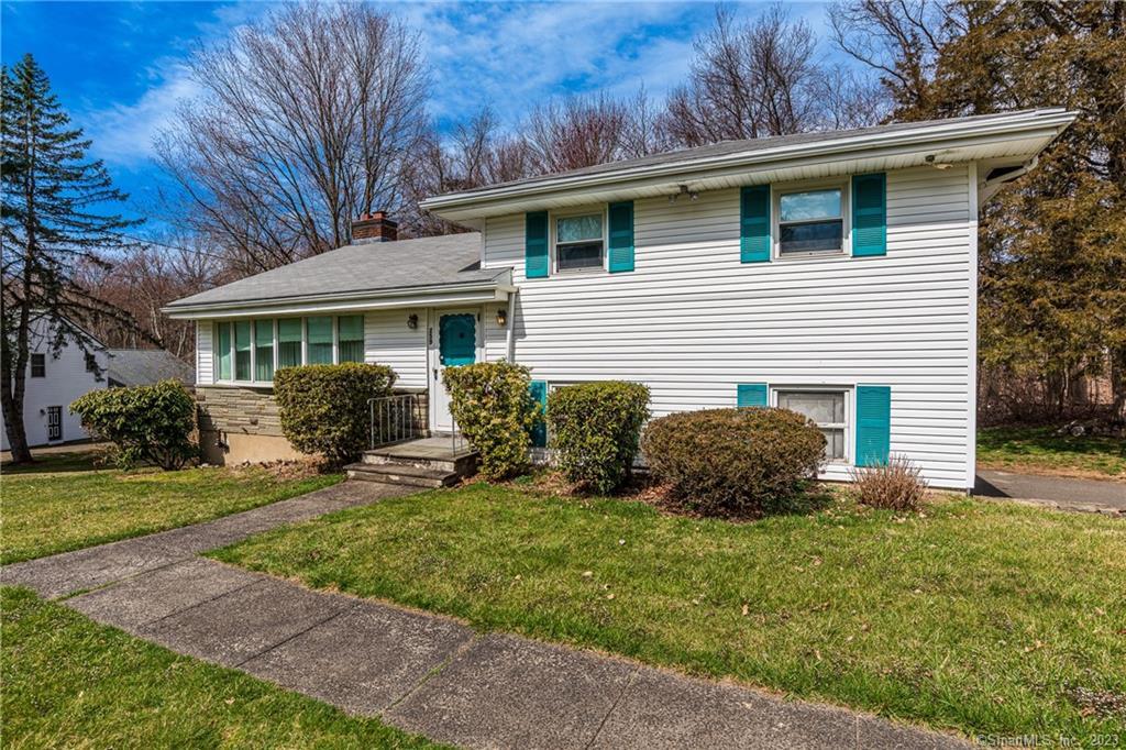 259 Plattsville Road Trumbull, CT 06611 - Photo 1 of 1 a front view of a house with a yard and outdoor seating