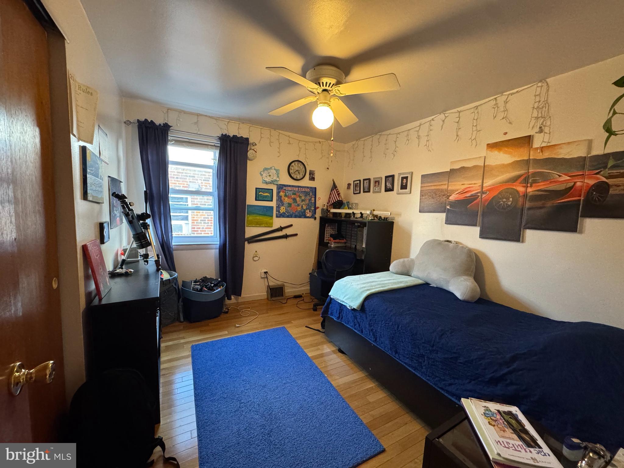 518 Parlin Street Philadelphia, PA 19116 - Photo 6 of 17 a bed room with a bed and a chandelier