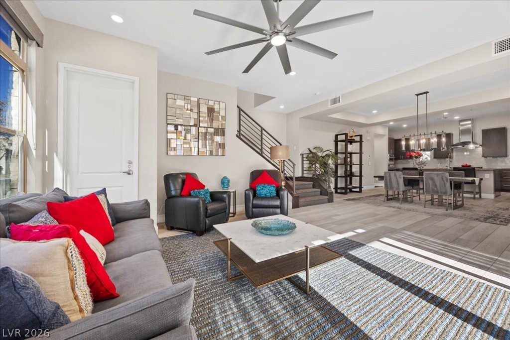 4262 Swift Street Las Vegas, NV 89135 - Photo 11 of 75 Living room featuring stairs, recessed lighting, ceiling fan, and dark wood finished floors