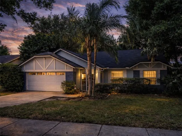 a front view of house with yard and green space