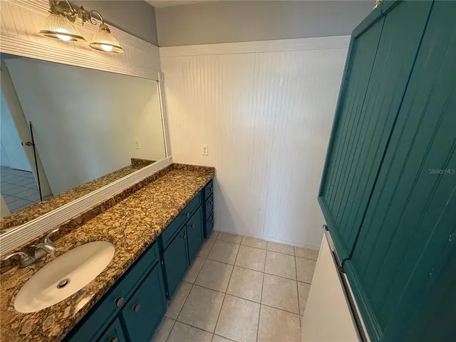 a bathroom with a sink and a shower