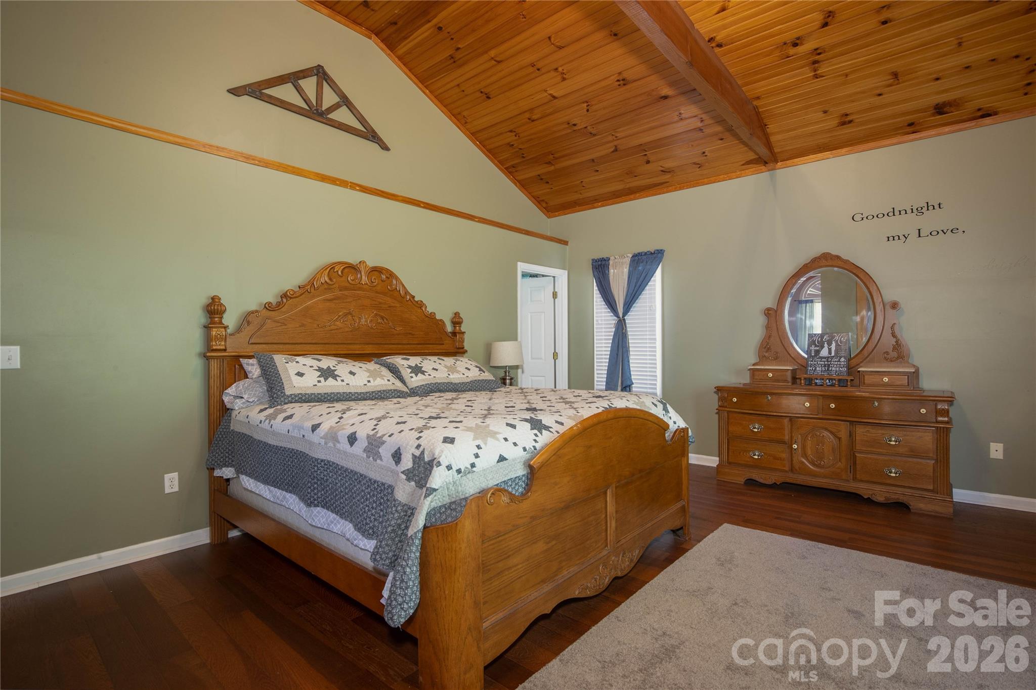 84 Sheets Farm Road Bakersville, NC 28705 - Photo 34 of 42 a bed sitting in a bedroom next to a window