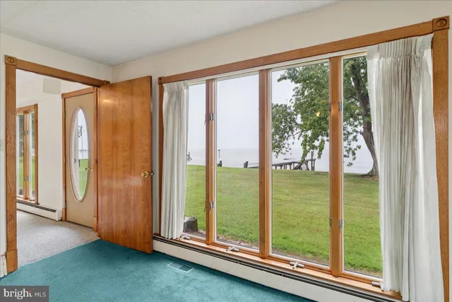 a spacious bedroom with a bed and a couch