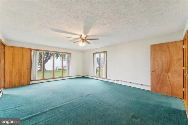 a view of front door with a floor to ceiling window