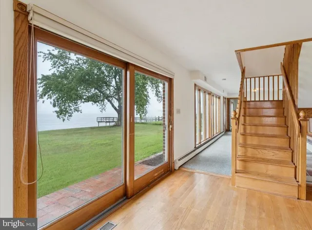 a large kitchen with stainless steel appliances granite countertop a stove and a sink