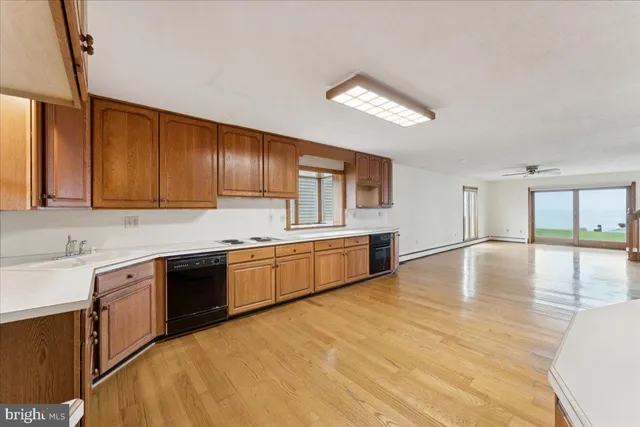 a view of an entryway with wooden floor
