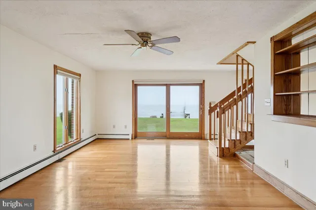 a view of a livingroom with wooden floor
