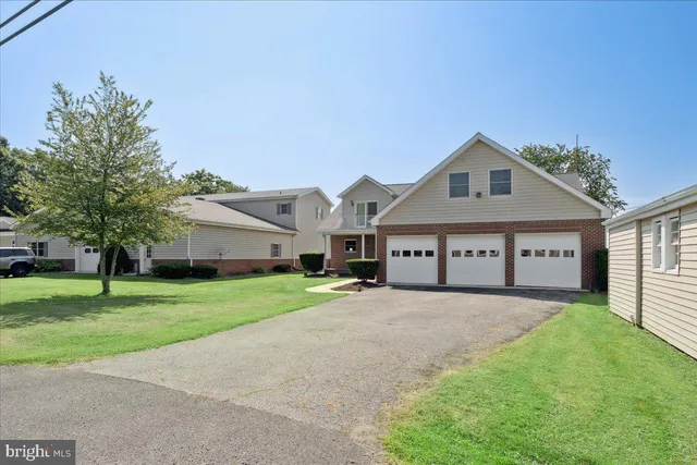 a house view with a sitting space and garden