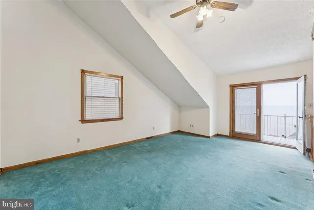 a bedroom with a bed and lamp