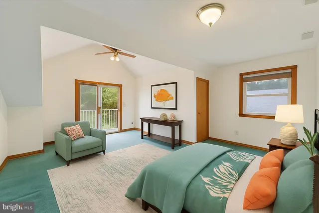 a bedroom with two beds and a painting on the wall