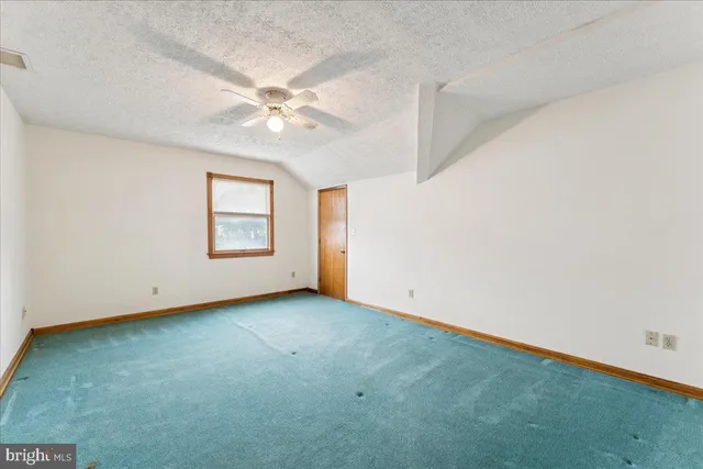 a balcony with trees in front of it