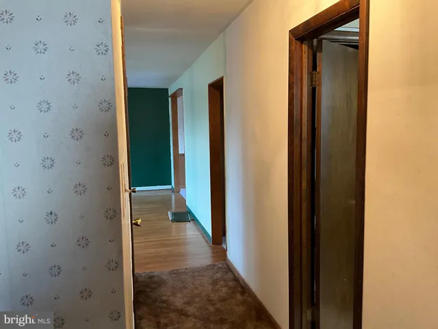 a view of a bathroom from a hallway