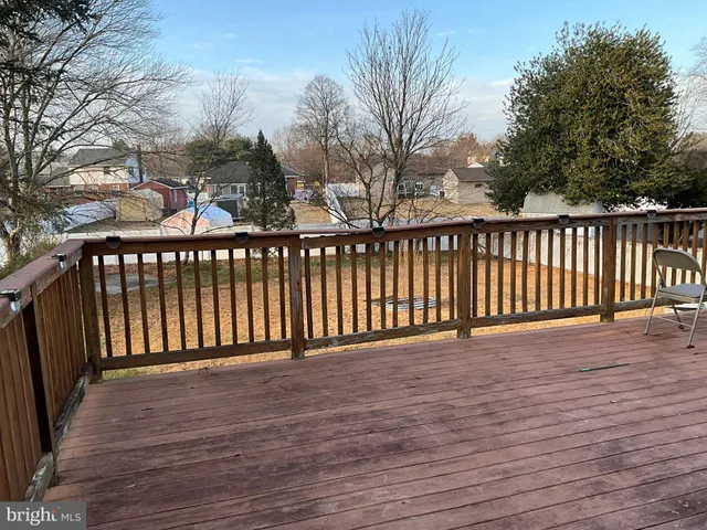 a view of a balcony with wooden floor