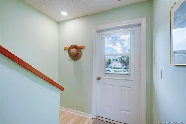 a kitchen with granite countertop a sink stainless steel appliances and cabinets