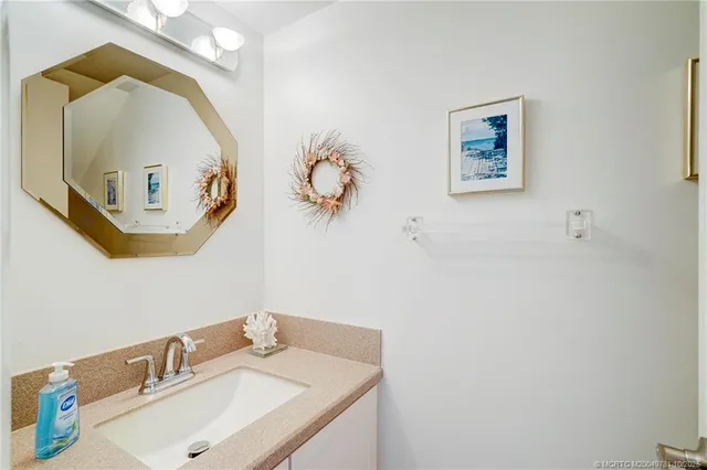 a view of a dining room with furniture wooden floor and a chandelier