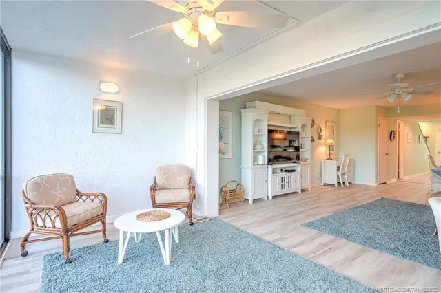 a bedroom with a bed and painting on the wall