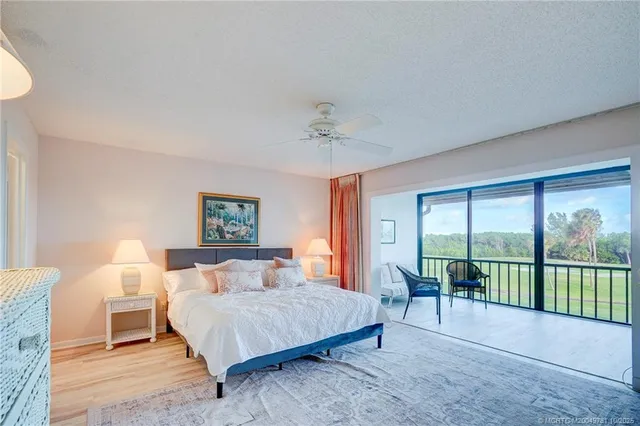 a bedroom with furniture and a wooden floor