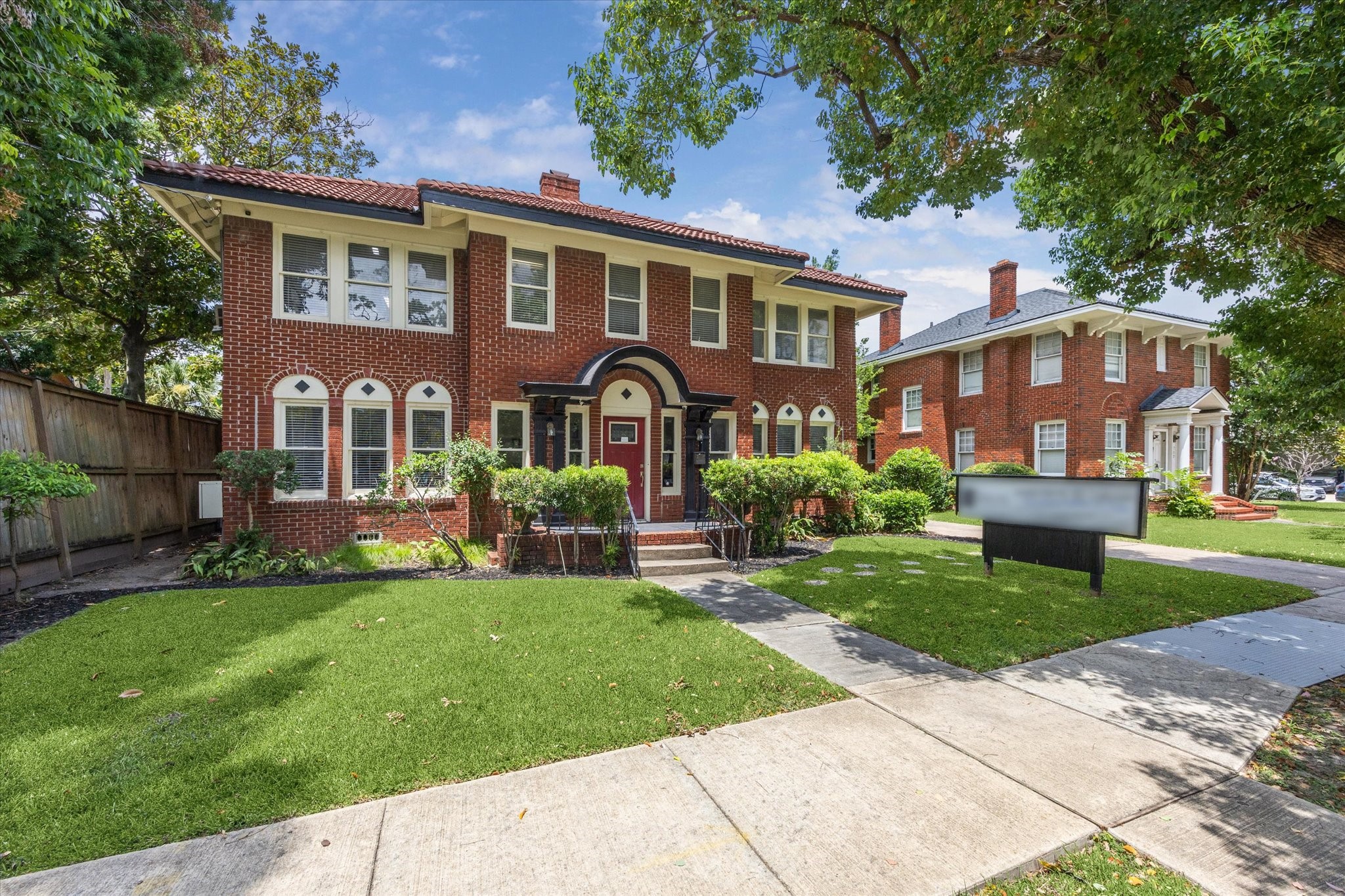 front view of a house with a yard