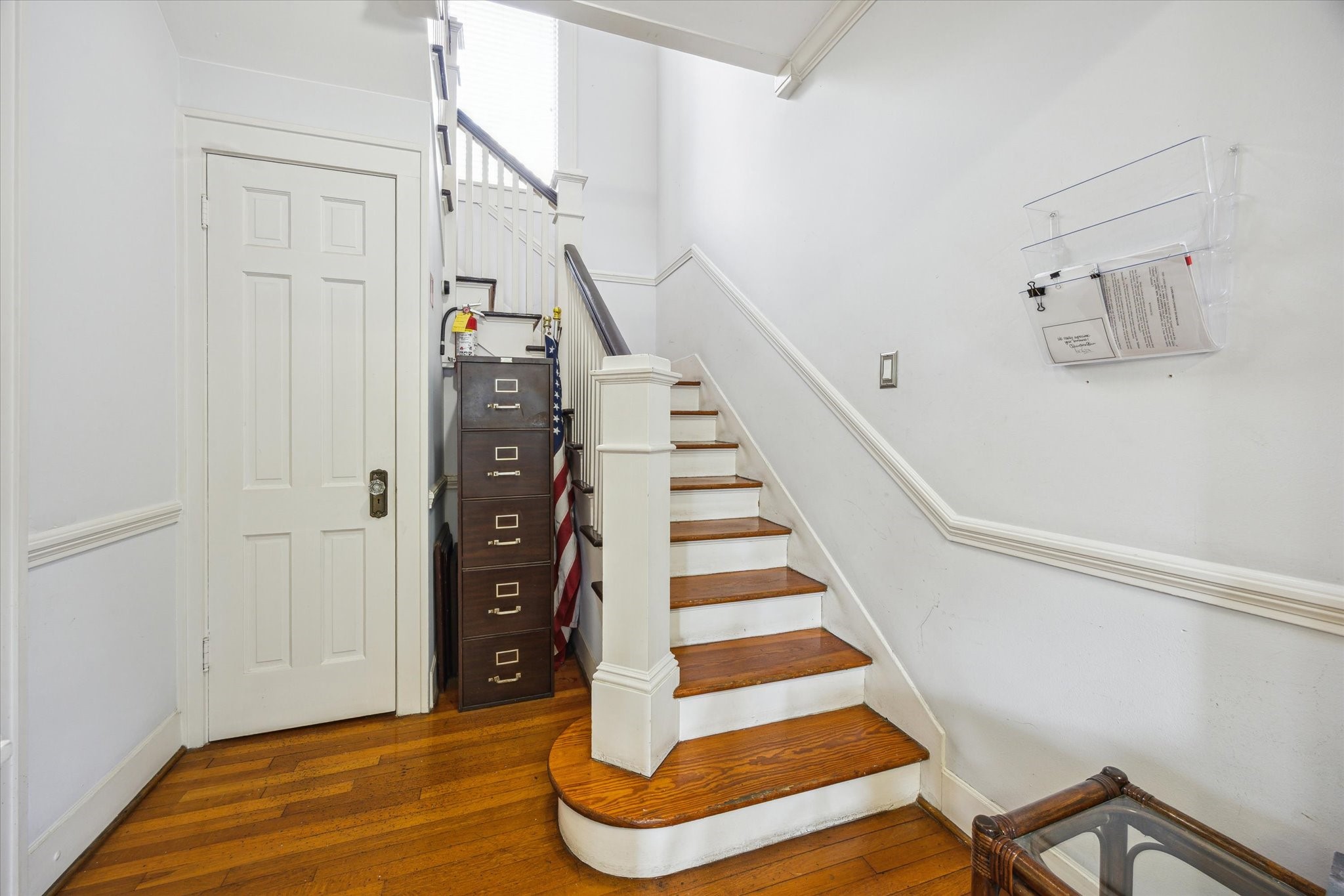 708 Sul Ross Street Houston, TX 77006 - Photo 14 of 30 a view of entryway with stairs and wooden floor