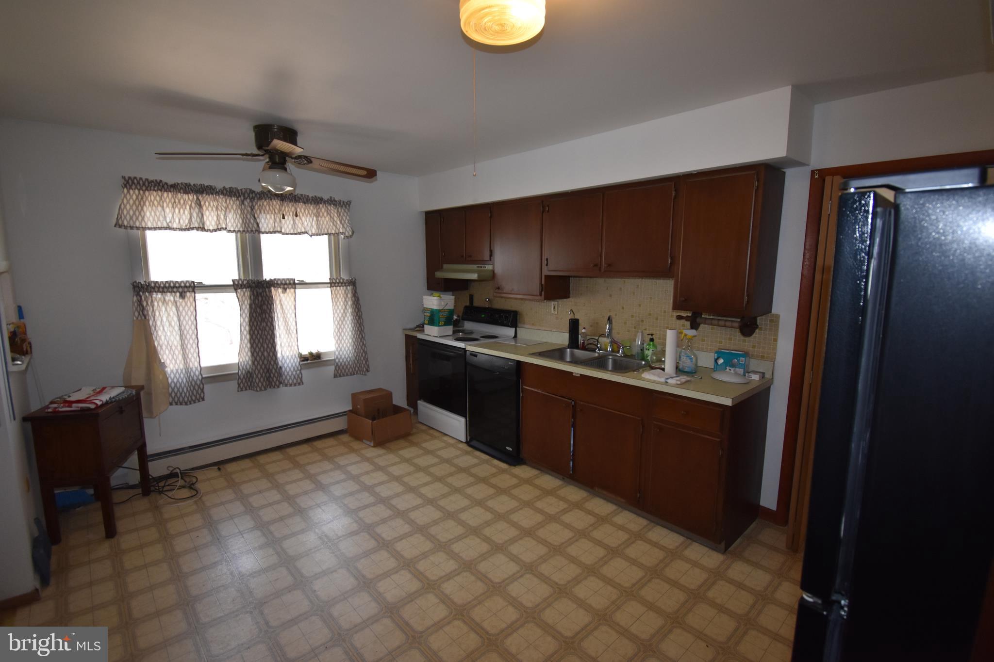 1271 Old York Road Burlington, NJ 08016 - Photo 4 of 17 a kitchen with granite countertop a refrigerator cabinets and wooden floor