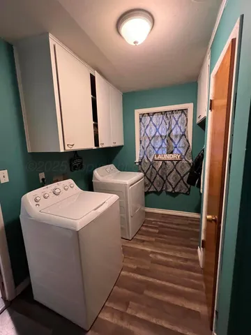 a view of bathroom with washer and dryer