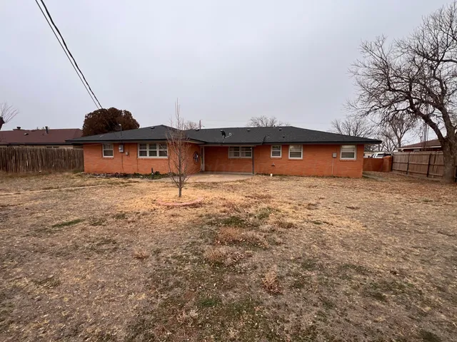 a front view of a house with large garden