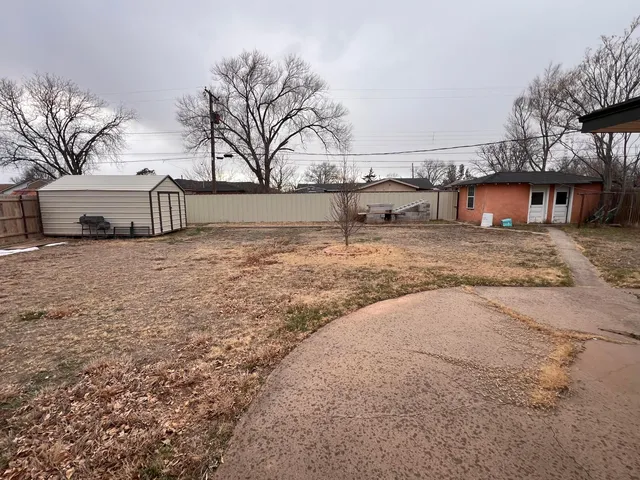 a big house with trees in front of it