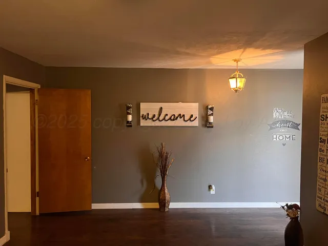 a view of entryway with wooden floor