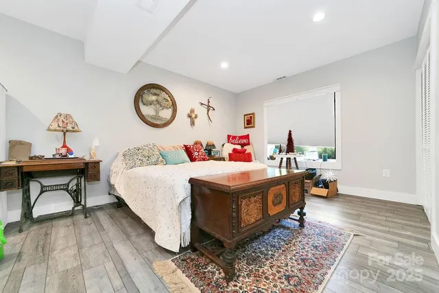 a bed room with a bed and a table