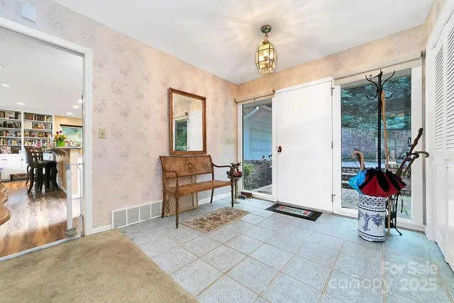 a view of a livingroom with furniture and front door