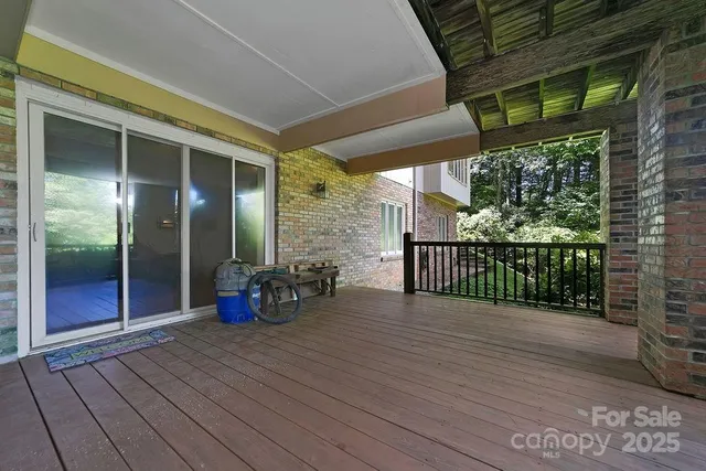 a view of two chairs in the balcony