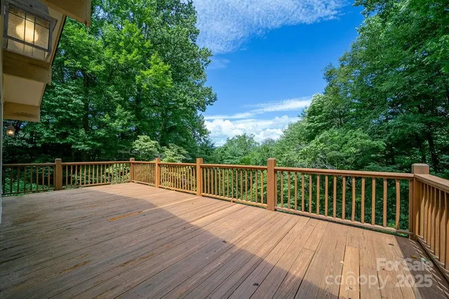 a view of balcony with deck and wooden floor