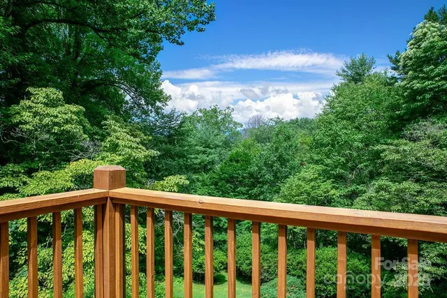 a view of a balcony with wooden floor