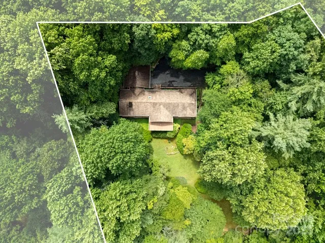 an aerial view of a house with pool