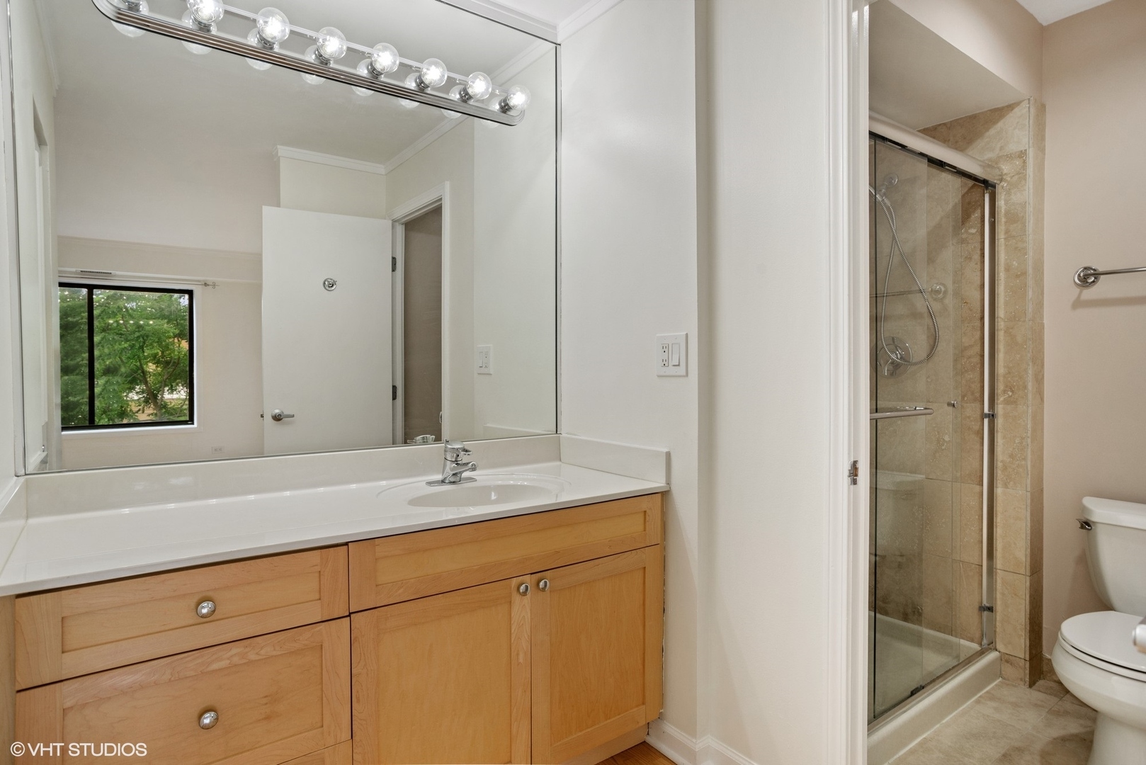 6102 North Sheridan Road, Unit 307 Chicago, IL 60660 - Photo 6 of 10 a bathroom with a sink a toilet and shower